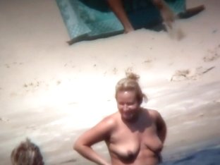 Mature Woman Showing Her Saggy Tits And Ass On Beach
