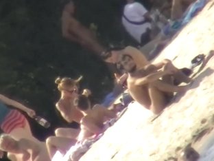 Sexy Chick Tanning Naked On The Beach And Caught On Cam