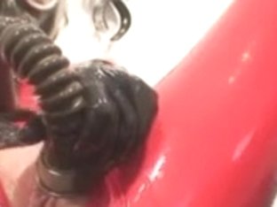 Lady Dressed In Red Latex Catsuit Gets To Sweet Climax