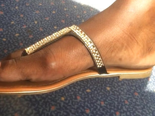Ultra Close-up Of Beautiful Ebony Feet On The Train