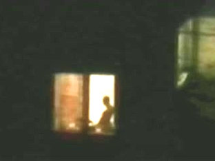 Horny Couple Caught Playing At Open Window
