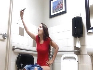Teen Taking Selfies While Peeing