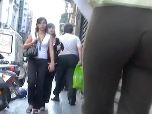 Milf In Black Pants Walks Through The City After Work
