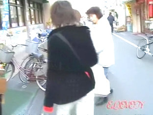 Tantalizing Oriental Brunette Gets Caught Off The Guard During Street Sharking