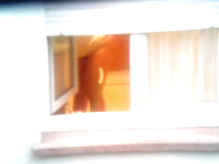 Guy Made A Window Peep Vid With A Chick Stripping