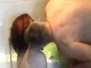 Redhead Gives Blowjob In A Bathtub