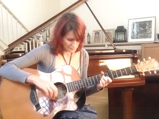 Redhead Playing Guitar Down Blouse And Cleavage