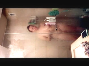 Girls on spy cam zealously shave hot legs in shower