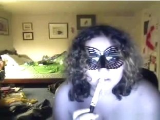 Fat Curly Haired Masked Brunette Girl Plays With Her Big Boobs, While Sucking A Lollypop.