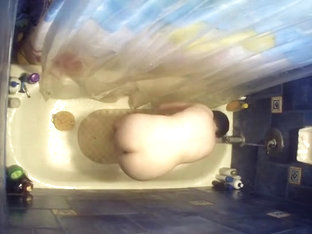 Nude Woman Bending Over In Bathtub