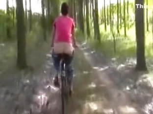 Kinky Girl With Naked Ass Rides The Bicycle Outdoors