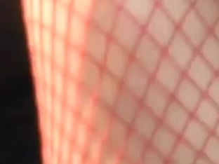 Upskirt Video Of A Girl Sitting In Red Fishnet Stockings