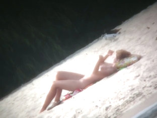 Spy Cam Shot Of A Hot Nudist Blond Tanning On The Beach