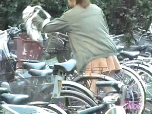 Asian girl on the bicycle hottest slim legs up skirt armd00191