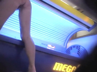 Mature Lady Wipes The Tanning Machine