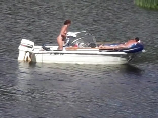 Nudist Couple Has Fun In The Middle Of A Beautiful Lake