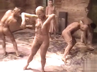 Naked Female Bodies Covered In Mud At Art Show