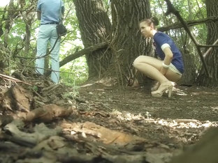 Guy Stands On Guard As His Girlfriend Pees Behind A Tree