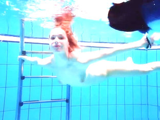 Redhead Babe Swimming Naked In The Pool