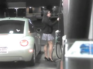 Short Skirt Girl Putting Gas In Car