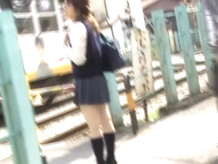 Teenage Oriental Hoe Is Waiting For The Bus During Street Sharking Action