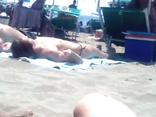Girl In Topless In The Beach
