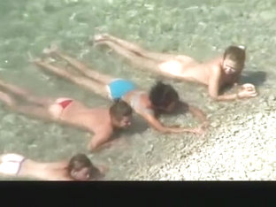 Nudist Chick And Friends In Beach