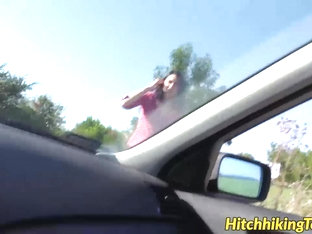 Stranded brunette hair in a mini petticoat receives a ride hitchhiking