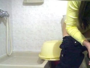 Dark-haired Cutie Spied While Sitting Her Butt On A Toilet