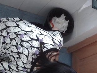 Dark-haired Asian Babe Pissing In The Public Toilet