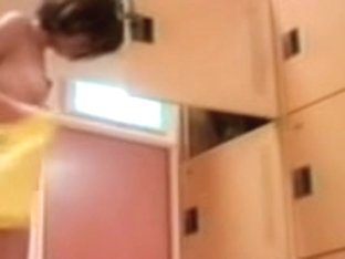 Brunette Asian in changing room changing her cloths