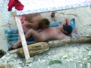 Voyeur Tapes A Nudist Couple Having Oral Sex At The Beach