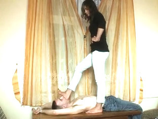 Dark Haired Doll Tortures A Handsome Guy With Her Delicious Feet