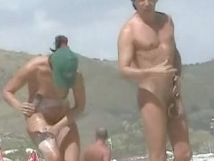 Naked Babes Caught On The Voyeur Camera Relaxing On The Beach