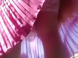 Whorish Chick In Pleated Pink Skirt Poses On Camera