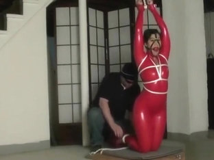 Bondage In Straigh Latex Catsuit And Ball Gag