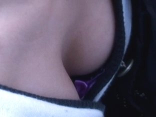 Cute Japanese lady downblouses her big tits on