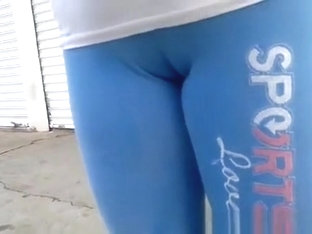 Woman In Tight Blue Sports Pants Big Cameltoe