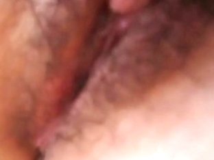 Asian chick with hairy cunt fingering herself