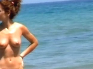 Skinny Bitch Proudly Reveals Her Breasts On The Beach