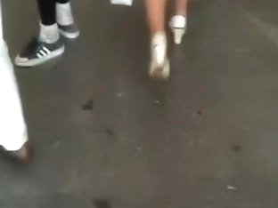 Chick In Shiny Hose Walking Down The Street