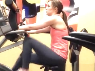 Woman Exercising Legs In Gym