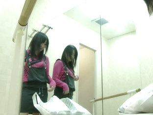 A Spy Camera In Changing Room Takes A Full View Of An Asian Changing Her Clothes