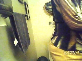 A Thick Woman With Big Tits Pissing In The Public Restroom