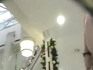 Slim Woman In A Mall Is Being Followed By Excited Voyeur