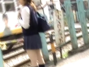 Teenage Oriental Hoe Is Waiting For The Bus During Street Sharking Action