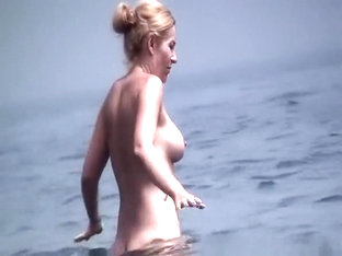Tattooed Nudist And Other In Beach