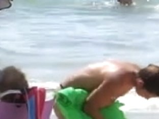 Topless legal age teenager with not her grandfathers at beach