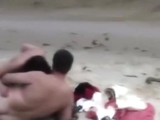 Voyeur Tapes A Nudist Girl Riding Her BF At The Beach