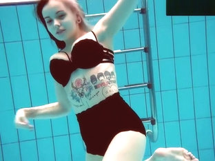 Tattooed Baby Swirls Underwater